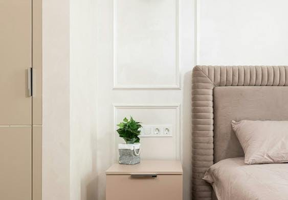 Bedside table with a small plant